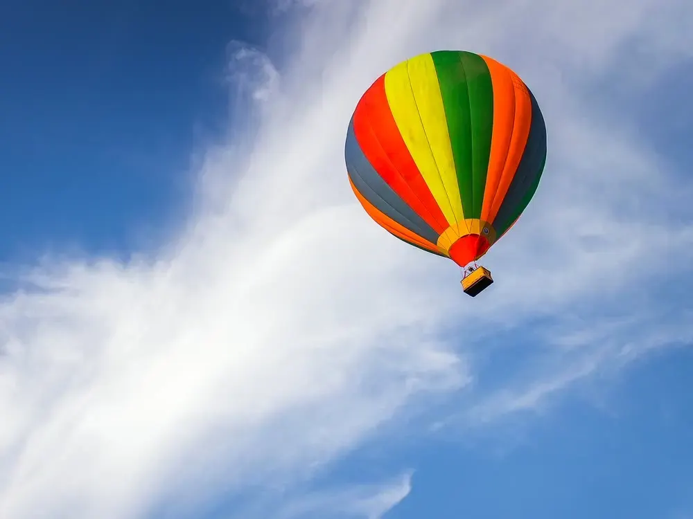 A hot-air balloon against clouds