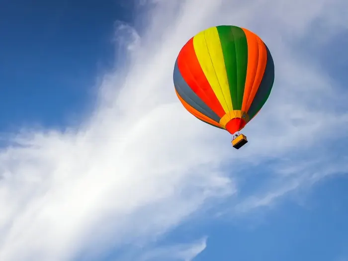 A hot-air balloon against clouds