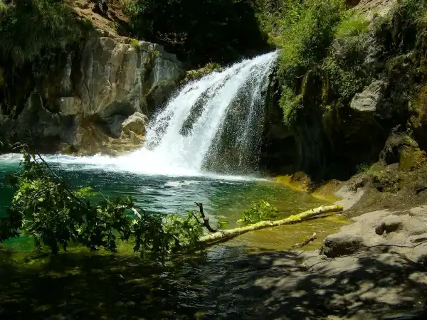 A waterfall dropping into a pool