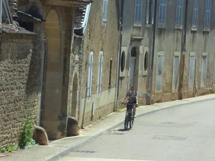 A cyclist on a village street