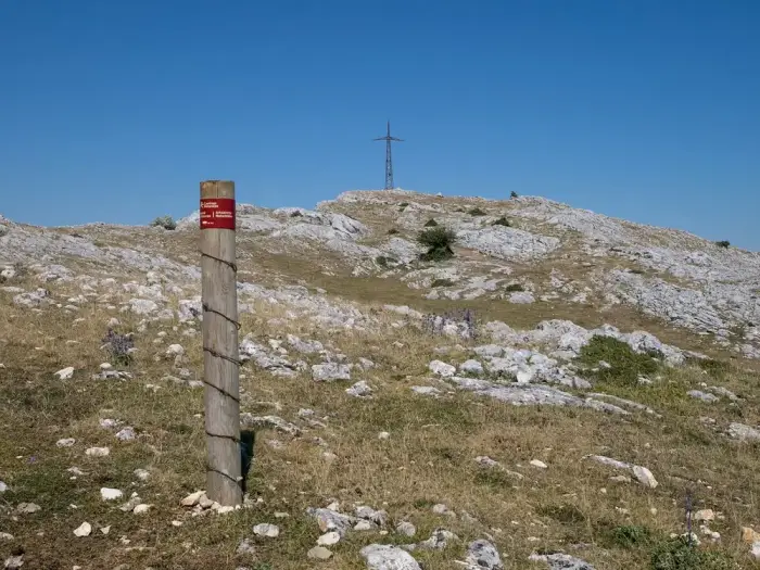 A stony ridge path across open highland