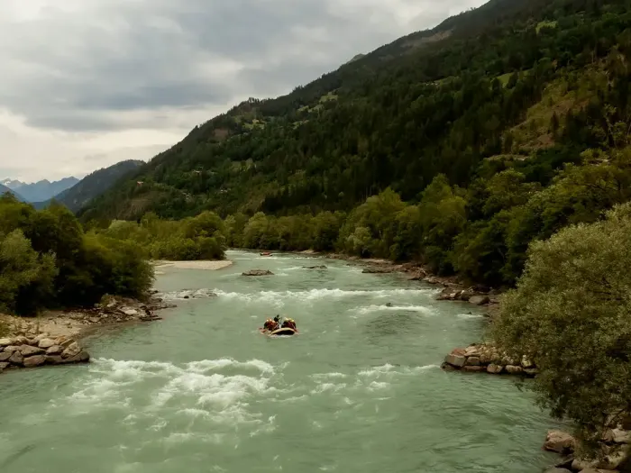 A river running through a wooded valley