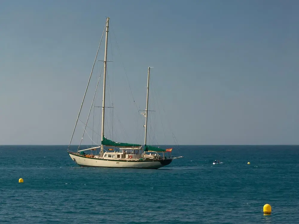 A sailing boat on open blue sea