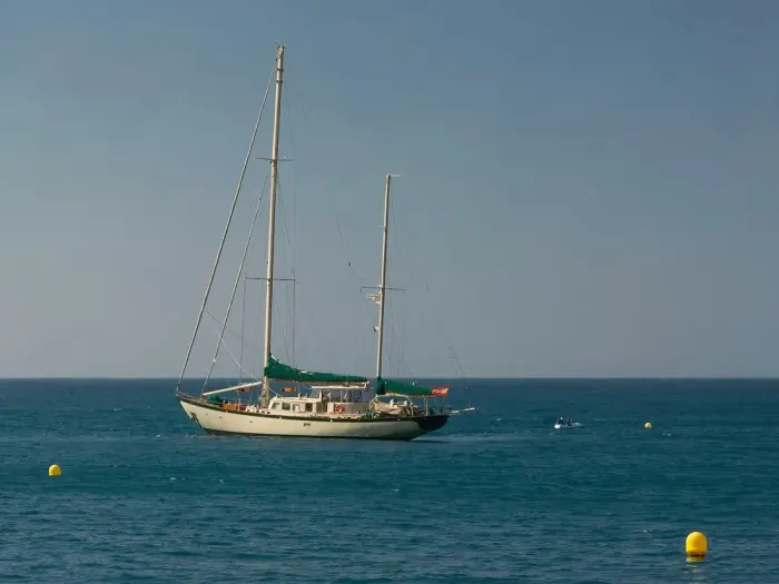 A sailing boat on open blue sea