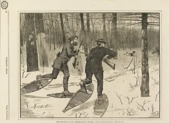 Snowshoers walking in single file across deep snow