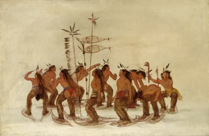 Snowshoers walking in single file across deep snow