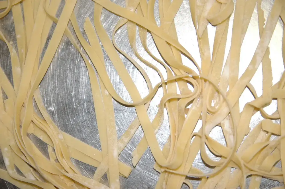 Fresh tagliatelle spread out to dry