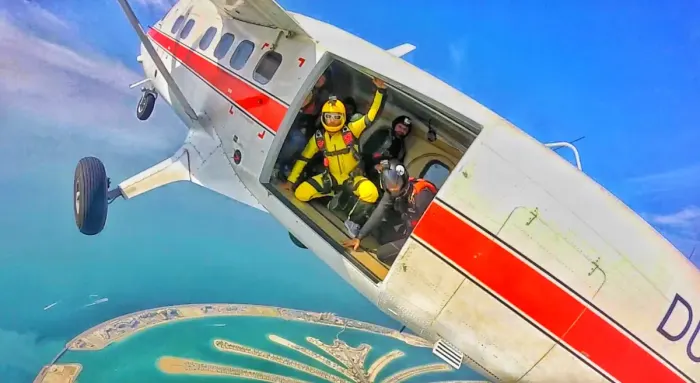 Skydivers leaving the aircraft in tandem