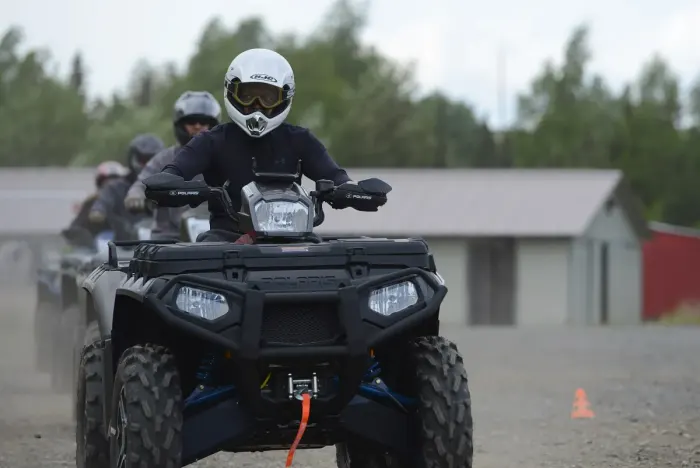 A rider on a quad bike on a dirt track