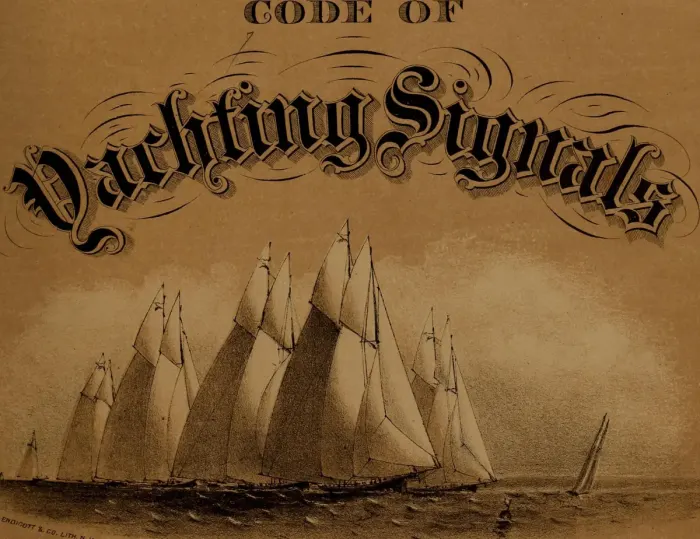 A sailing boat under white sails on open water