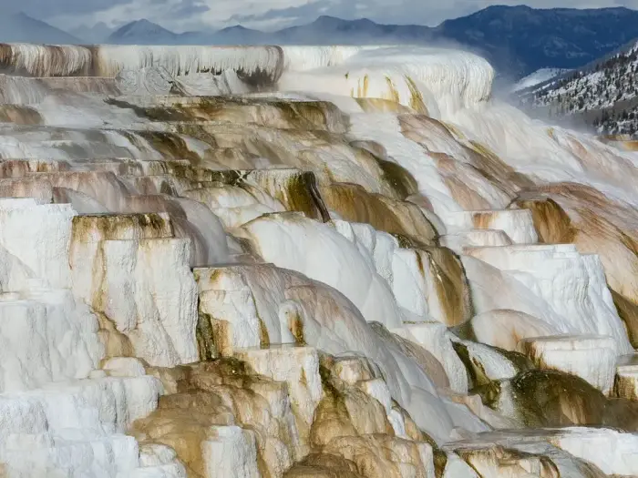 Terraces of white travertine formed by thermal water